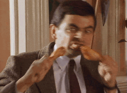 mister Bean eet heel snel twee kippenboutjes